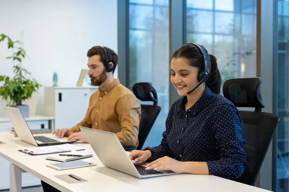 Man and woman working in a call center