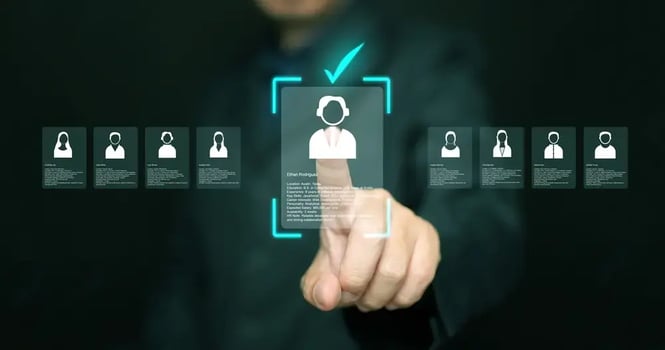 Manager analyzing employee listings on a virtual screen.