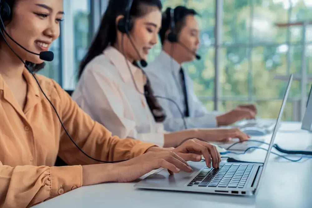 People wearing headsets working